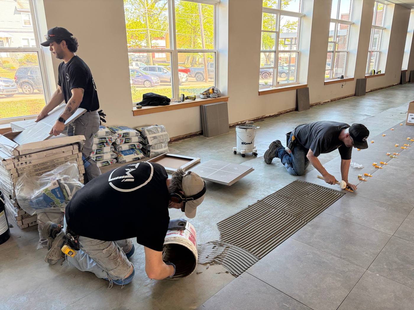 TMI crew setting large-format porcelain tile
