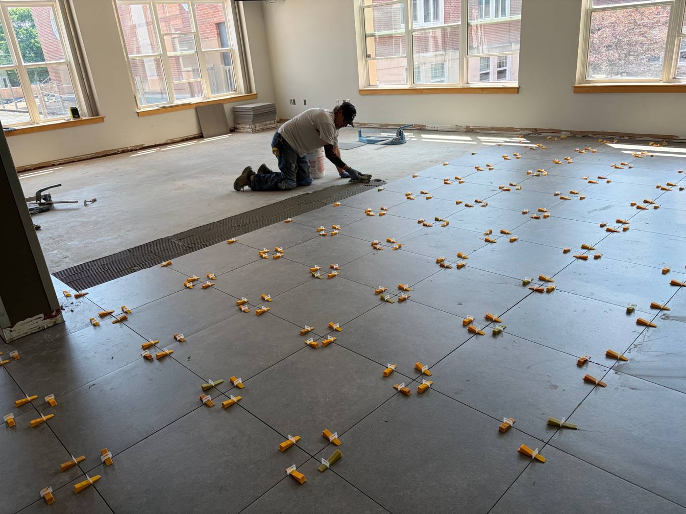 Holland College Upgrades, setting large-format porcelain