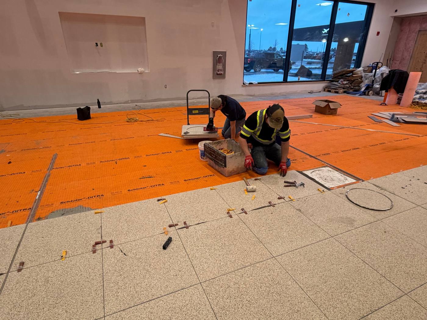 Charlottetown Airport Phase 2, porcelain tile around floor fixtures