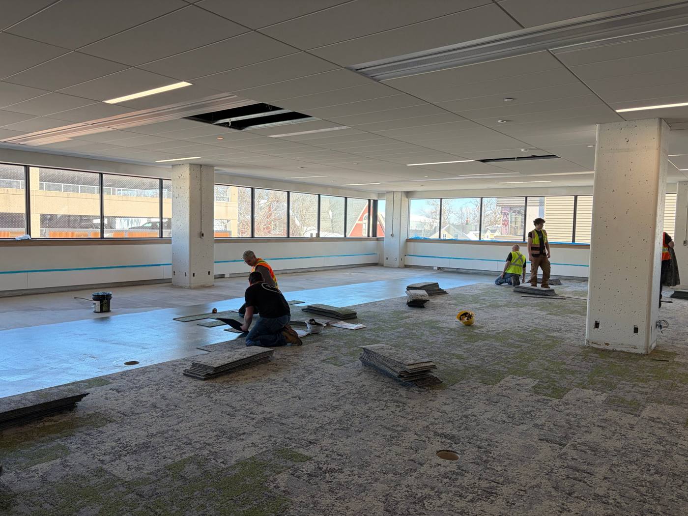 Daniel J. MacDonald Building, crew installing carpet tile