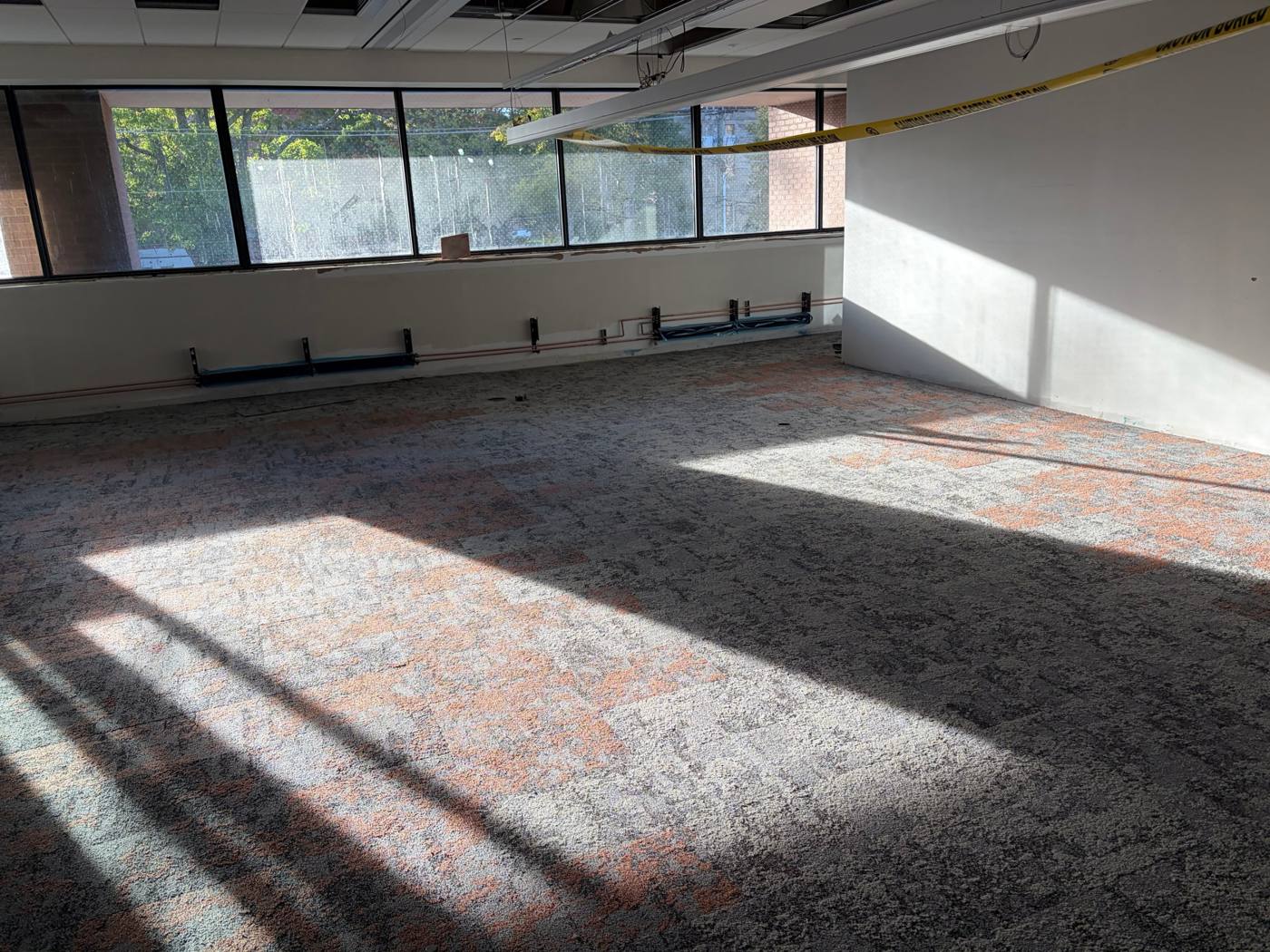 Daniel J. MacDonald Building, carpet tile in finished office space